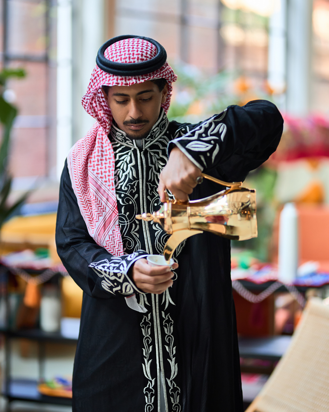 A Man Pouring Saudi Coffee